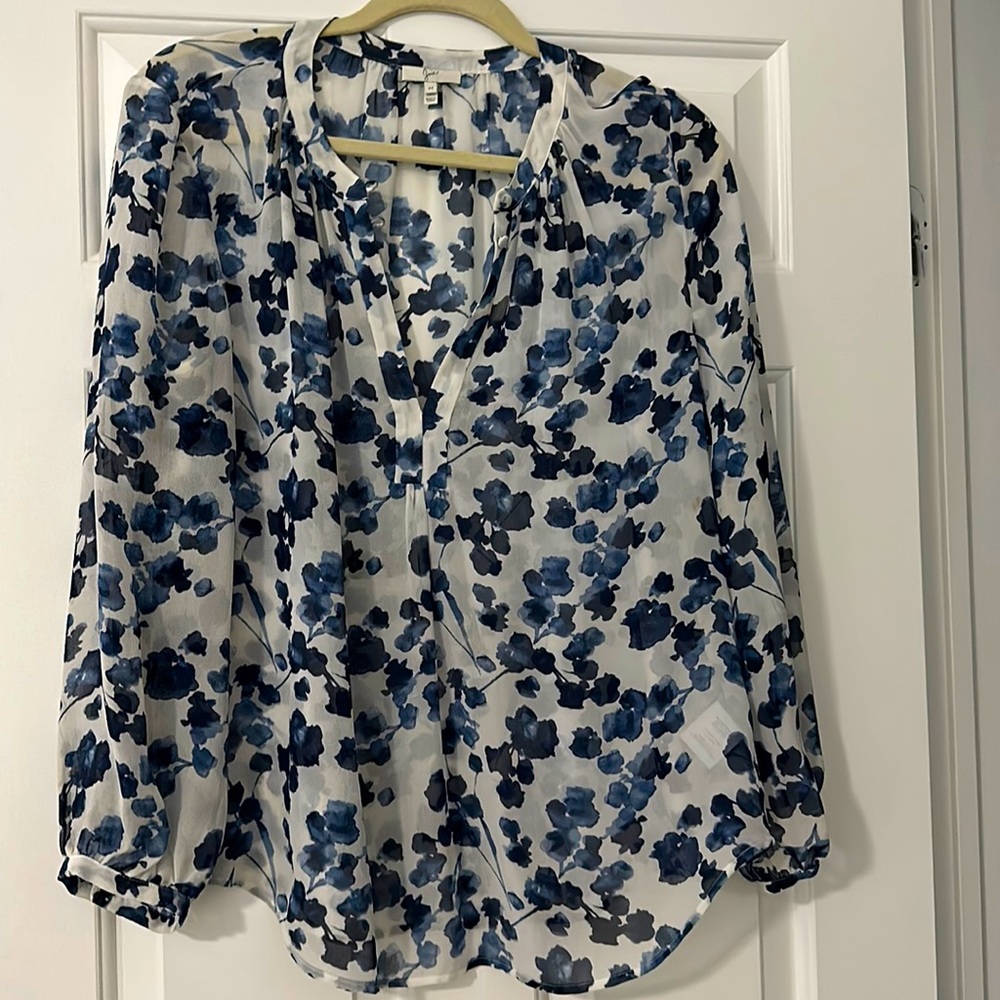 Beautiful floral blouse in hues of white and shades of navy